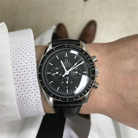 omega speedmaster with black leather strap